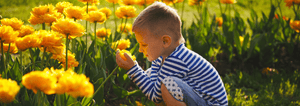 Boy holding flower