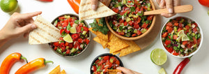 table full of chips and salsa