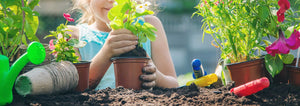 girl repotting flowers