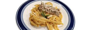 plate of pumpkin butternut squash fettuccine with turkey