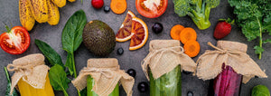 healthy fruits and vegetables on a gray background